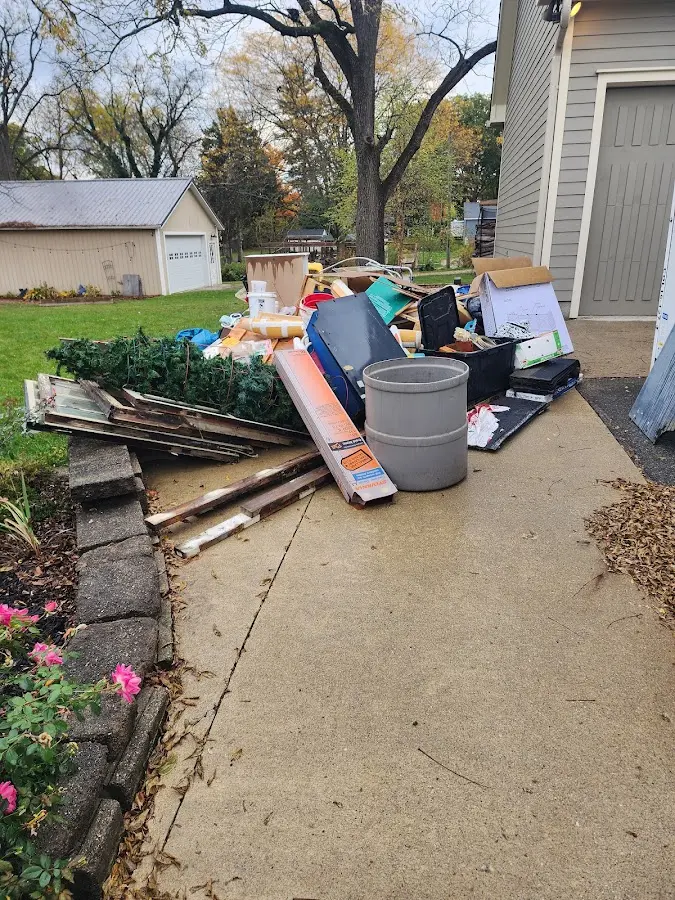 Dumpster being loaded with debris for 3 Yard Dumpster Rental in Carl Junction